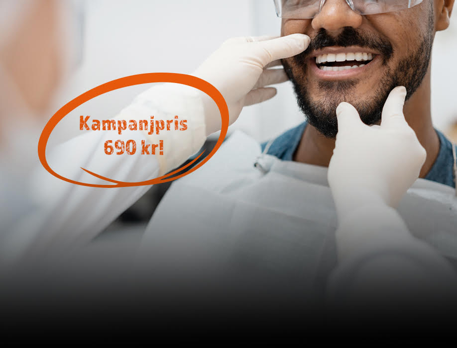 En man som får sina tänder undersökta av en tandläkare